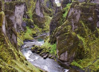 Discover the world’s most stunning canyons Iceland, Fjaorargljufur, Elevated view of Fjaora river flowing through steep rocky gorge