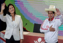 Supporters of Peru’s competing presidential candidates take to roads amid election frenzy